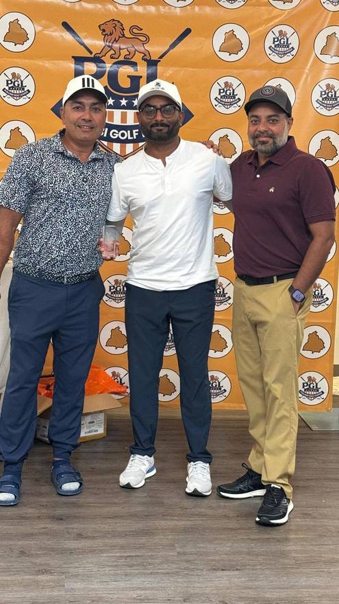 Three golfers in front of the Punjabi Golf League banner